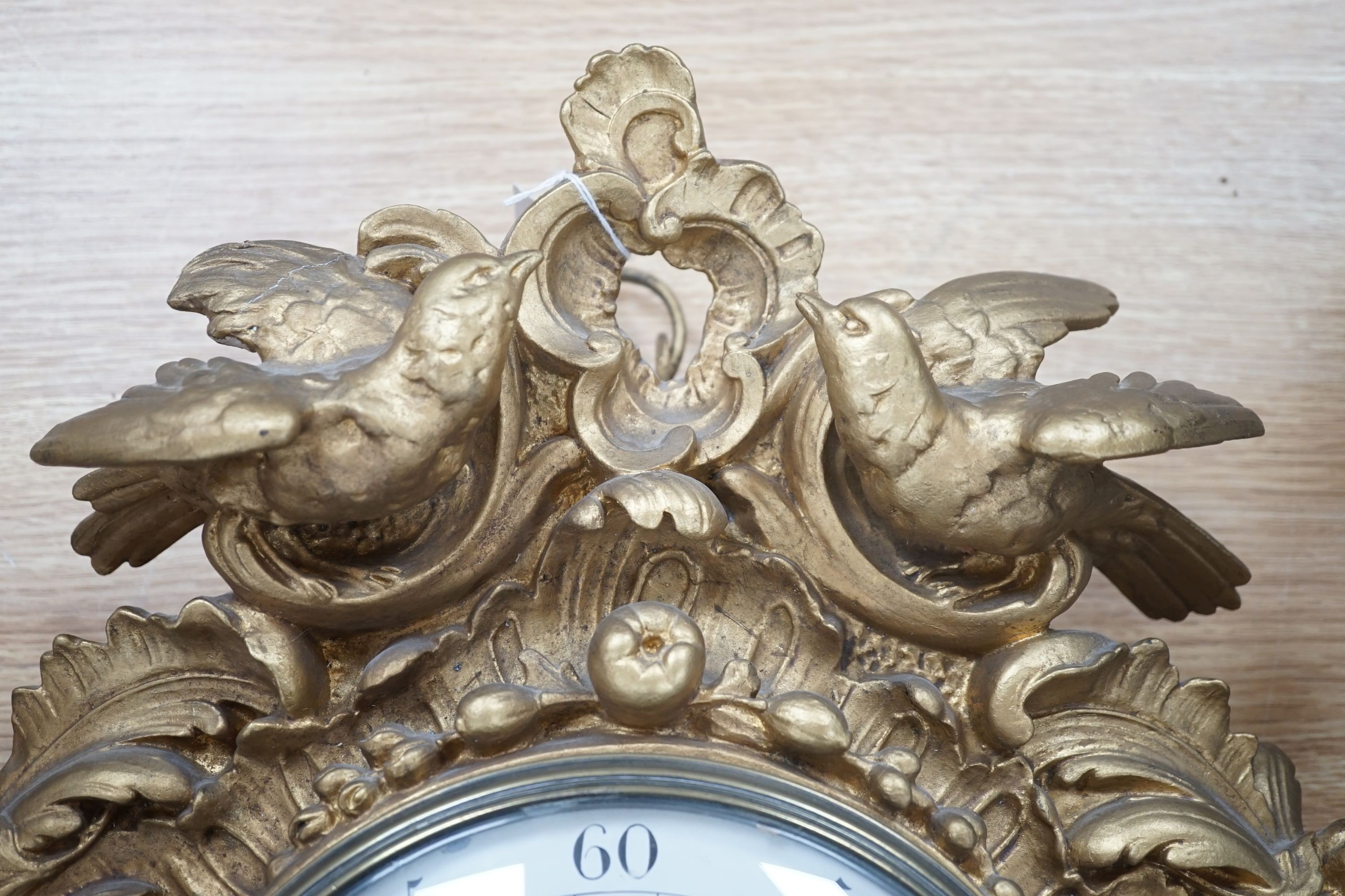A late 19th century French giltwood and composition wall clock, retailed by Charles Frodsham, 53 cm high